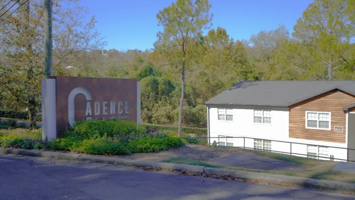 Charming apartment community surrounded by lush greenery with scenic views at Cadence at Bluff Park.