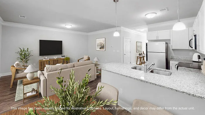 Modern open-concept living area featuring a sleek kitchen with granite countertops, stylish living room with cozy seating, and elegant decor.