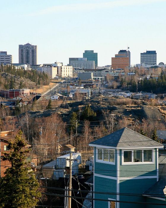 Charming cityscape view with a blend of urban buildings and a serene natural landscape, featuring a colorful blend of architecture.