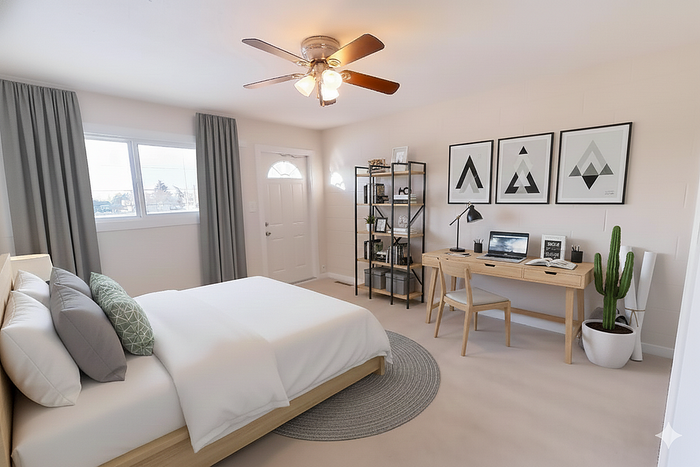 Bright and modern bedroom with stylish workspace, featuring a cozy bed, elegant decor, and abundant natural light.