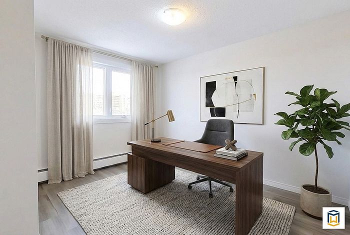 Modern home office with sleek wood desk, stylish chair, and natural light from large window. Elegant decor includes abstract wall art and a lush potted plant, creating a serene and productive workspace.