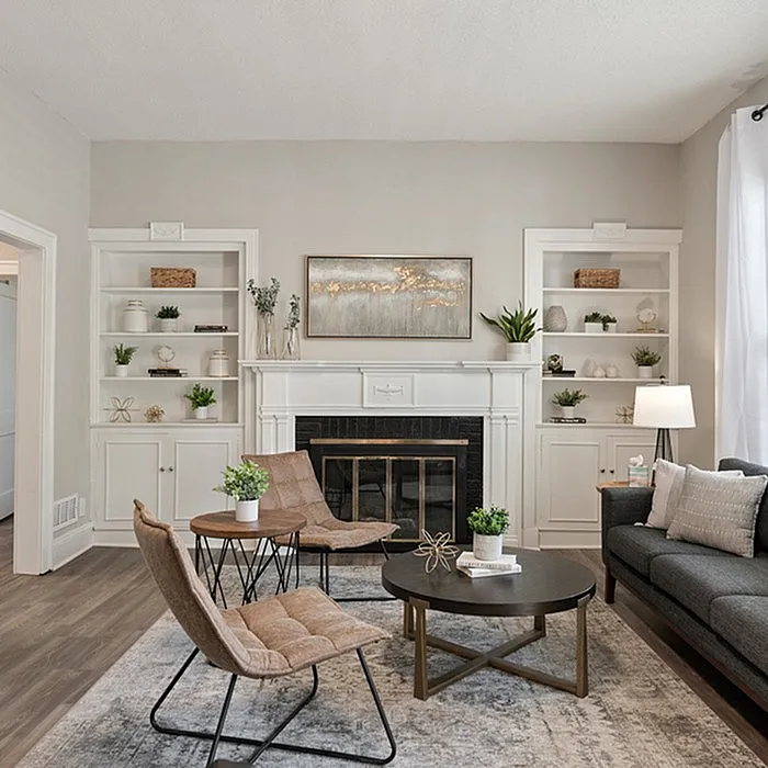 Stylish living room featuring a cozy fireplace, modern furniture, and decorative shelving.