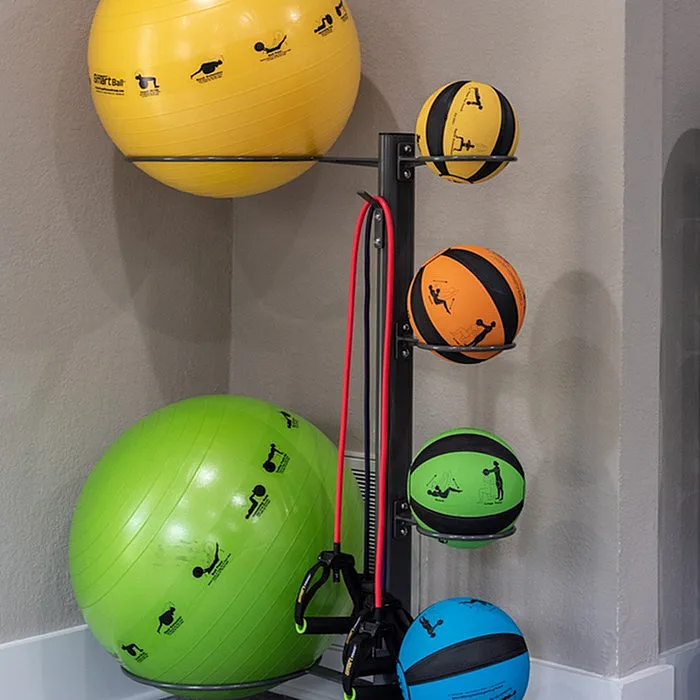 Vibrant fitness corner with colorful exercise and stability balls alongside resistance bands, perfect for a home workout setup.