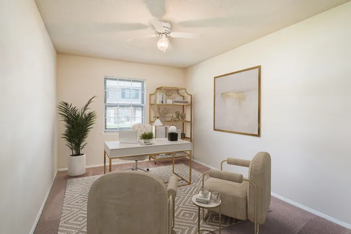 Bright and inviting home office with modern decor, featuring a sleek desk, cozy chairs, and natural light pouring in through the window.