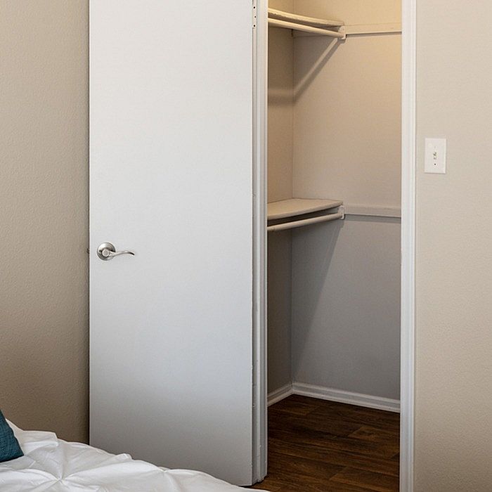 Inviting walk-in closet with ample storage space, perfect for organizing your wardrobe in style.