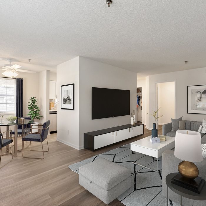 Luxurious open-concept living space with modern decor, featuring a cozy living room, elegant dining area, and contemporary kitchen with ample natural light.