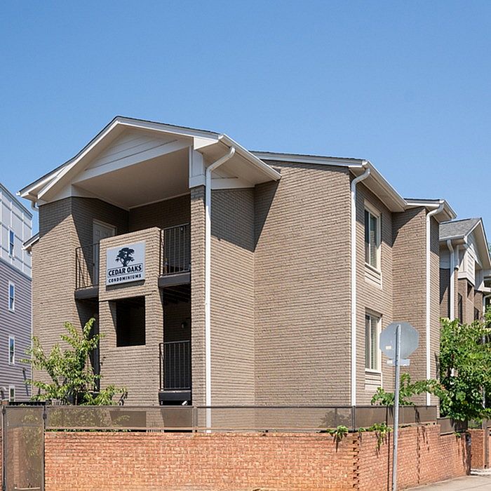 Elegant Cedar Oaks Condominiums showcasing modern architecture and inviting balconies.