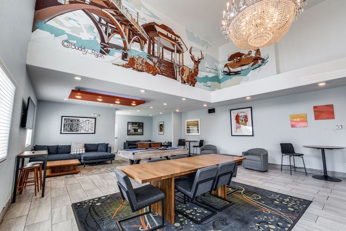 Community lounge at Gruene Pointe in New Braunfels, TX with stylish seating and wall art