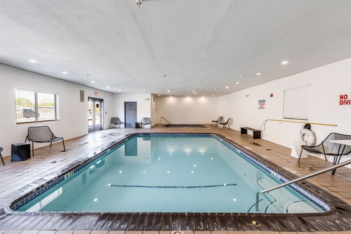 Indoor pool lounge at Gruene Pointe in New Braunfels, TX with modern seating and bright lighting