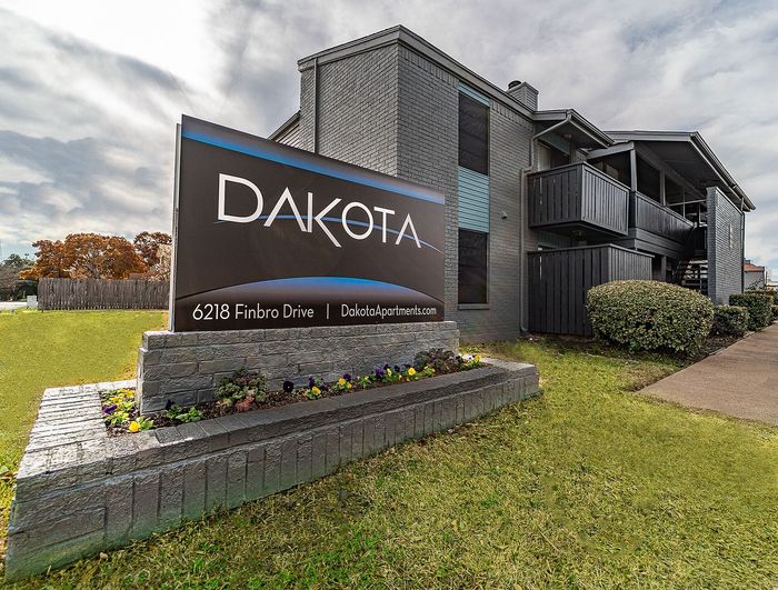 Dakota Apartments building exterior and signage at 6218 Finbro Drive in Fort Worth