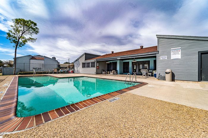 Outdoor pool with seating at Dakota Apartments in Fort Worth