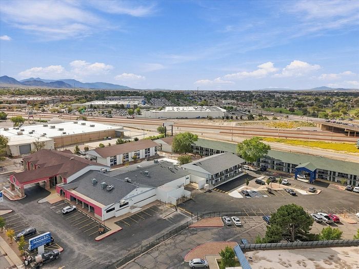 Wide aerial view of Juniper Flats and Northeast Albuquerque with the Sandia Mountains on the horizon