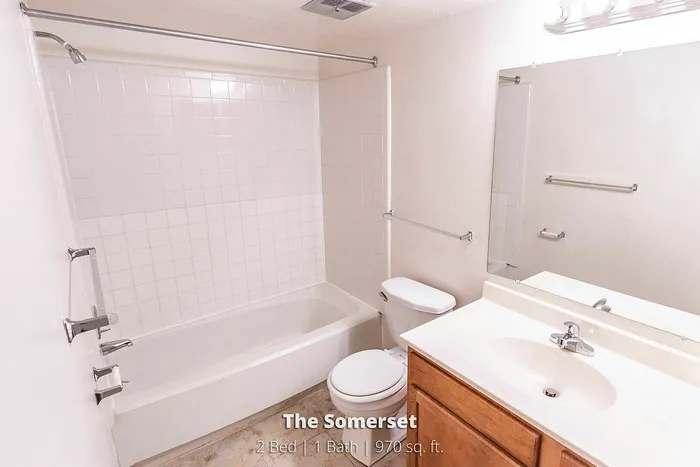 Bright and inviting bathroom in The Somerset, featuring modern fixtures and a spacious tub. Perfect 2 Bed 1 Bath unit with 970 sq. ft. of comfort.