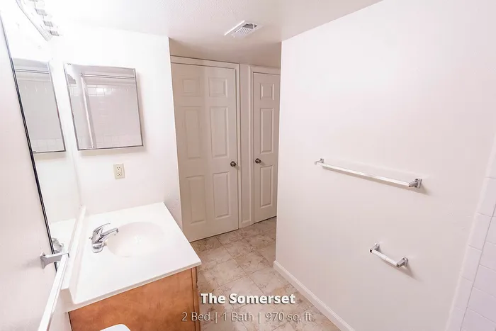 Bright and airy bathroom with modern fixtures in The Somerset, a 2-bed, 1-bath apartment offering 970 sq. ft. of comfortable living space.