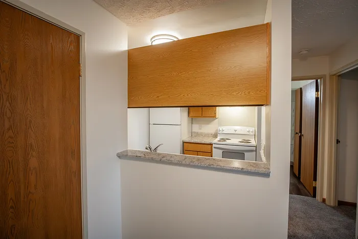Cozy kitchen nook with modern appliances, warm wood accents, and ample natural light.