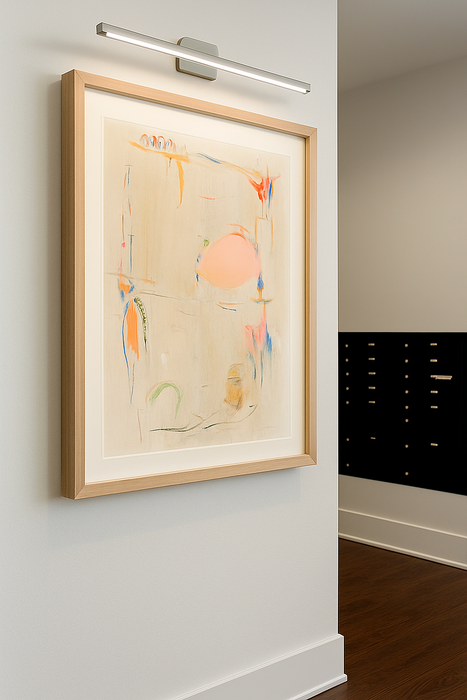 Contemporary hallway featuring modern abstract art in a sleek wooden frame, illuminated by stylish overhead lighting.