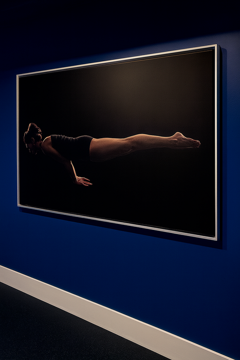 Elegant modern artwork featuring a person in a floating pose, beautifully framed against a deep blue wall.