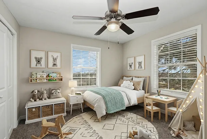 Charming children's bedroom with cozy decor and playful accents, featuring a plush bed, animal-themed artwork, and a delightful play tent with string lights.