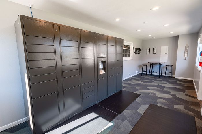 Secure package lockers at Huntington Oaks Apartments in Alvin, TX.