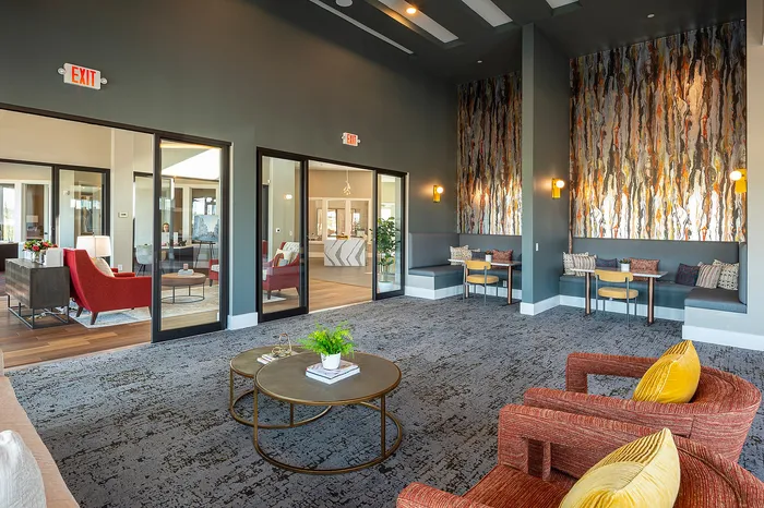 Contemporary lounge area with vibrant decor, comfortable seating, and modern accents, perfect for relaxation.