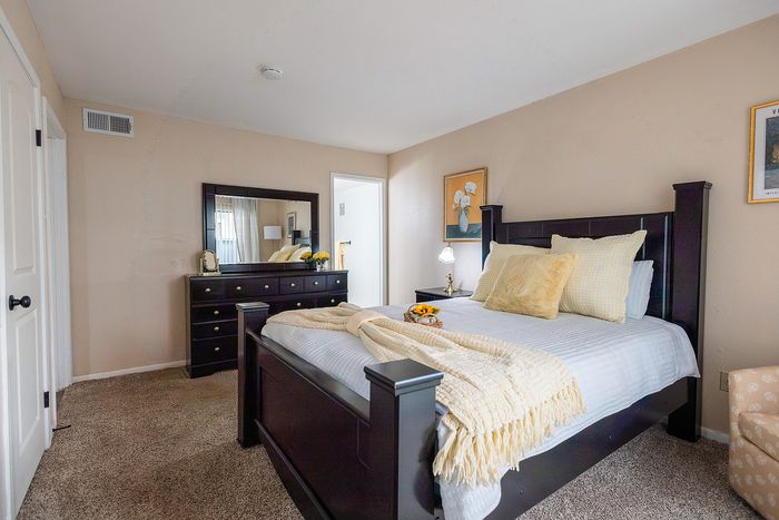 Spacious bedroom layout with neutral finishes at Waterchase Apartments in Humble, TX