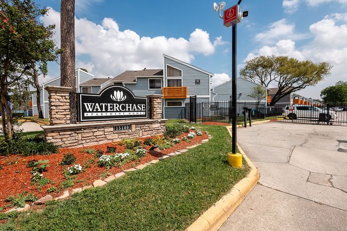 Waterchase Apartments monument sign and landscaped entrance in Humble, TX