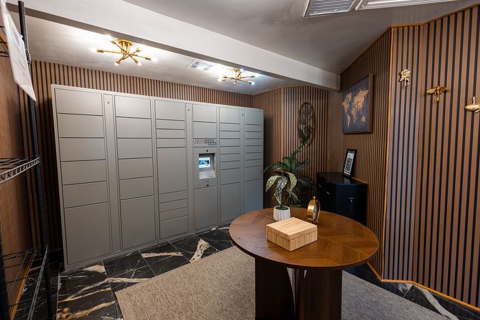 Secure parcel locker room with 24/7 package access