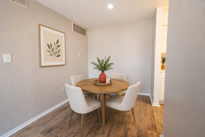 Dining area with wood-style flooring inside Green Meadows Apartments