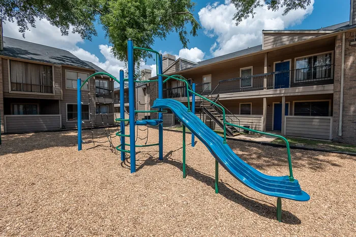 Outdoor play area at Green Meadows Apartments in Houston, TX