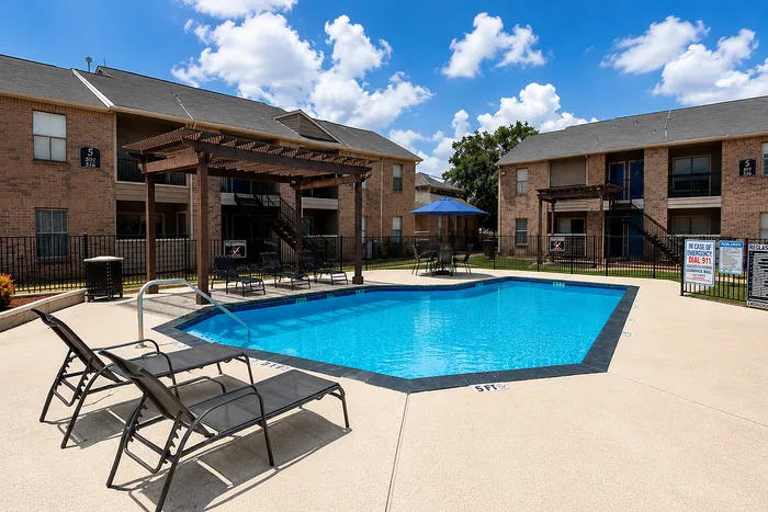 Wide view of the swimming pool area at Green Meadows Apartments in Houston TX
