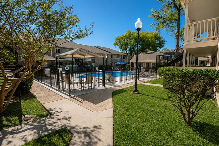 Community swimming pool at Huntington Oaks Apartments in Alvin TX