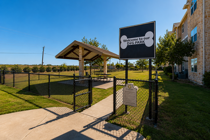 Inviting dog park with covered picnic area, perfect for pet-friendly living.