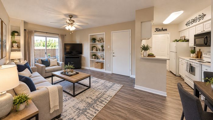 Open-concept apartment interior showing the living room, kitchen and entry at Parkside Apartments.