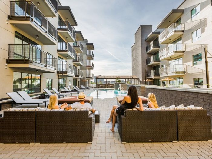Ample Poolside Seating At iLuminate Apartments In Phoenix, AZ