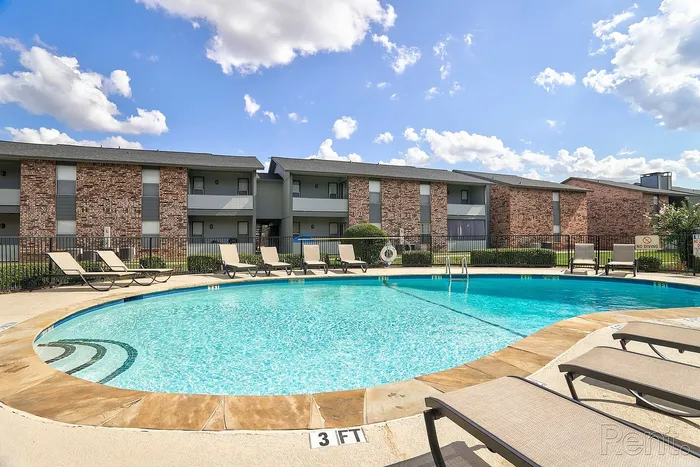 pool with lounge chairs at arbor creek