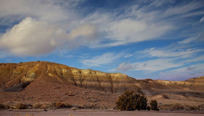 Beautiful desert landscape with rugged hills and a vibrant blue sky, perfect for exploring and enjoying nature.