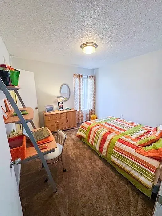 fun bedroom with bright beding