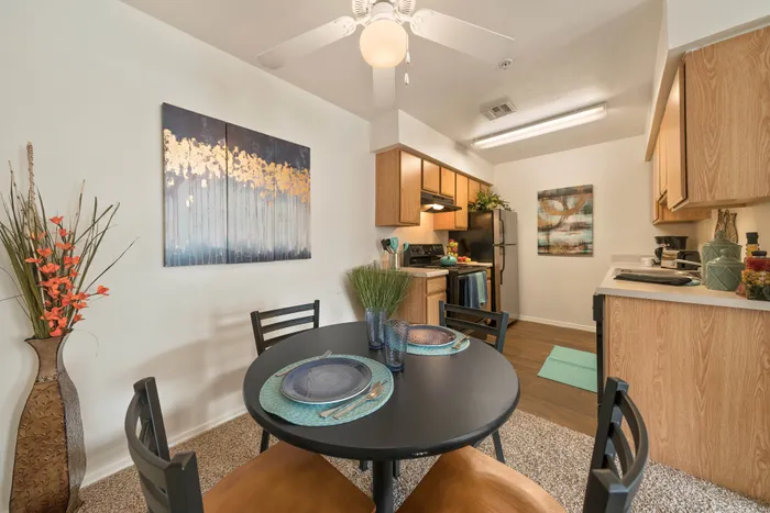 Charming modern kitchen with cozy dining area, elegant decor, and warm lighting, perfect for stylish apartment living.