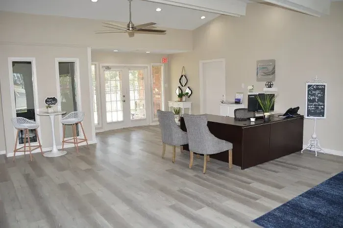 apartment leasing office with desk and computer