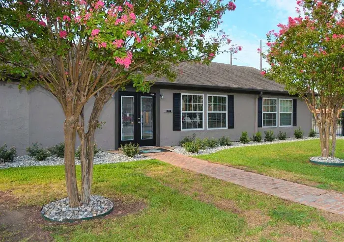 front of leasing office, with trees and grass