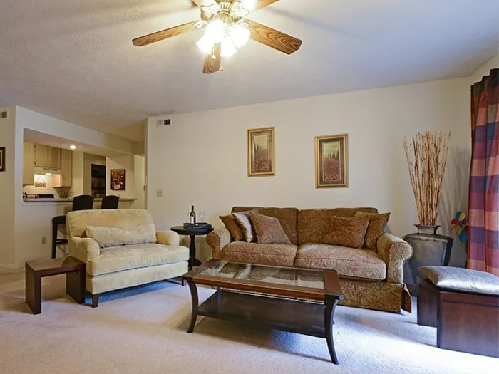 Inviting living room with cozy seating, elegant furnishings, and a warm, welcoming atmosphere.