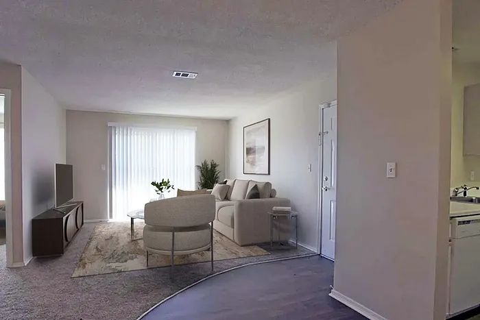 Bright and inviting living room with modern sofa, large window, and elegant decor, perfect for relaxation and entertaining.