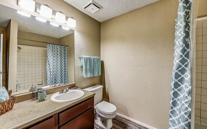 modern bathroom with bright lights and large vanity