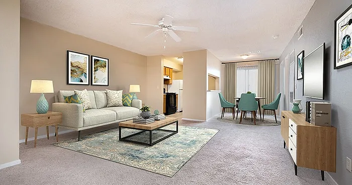 Chic open-concept living and dining area with modern decor, elegant furniture, and plush carpet, leading to a bright kitchen.