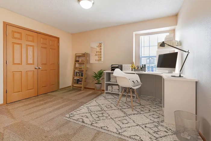 Bright, stylish office space featuring natural light, elegant desk setup, and cozy décor for an inspiring workspace.
