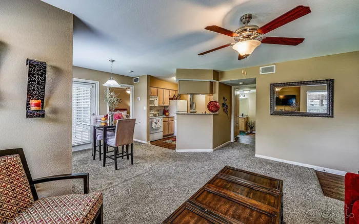 Bright and inviting open-plan living area with modern kitchen, cozy dining space, and elegant decor accents.