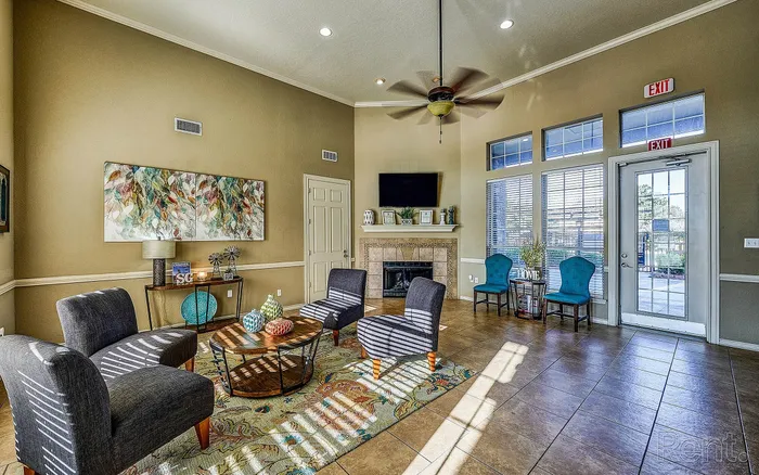 Inviting living room with vibrant decor, plush seating, and a cozy fireplace, perfect for relaxation and entertaining.