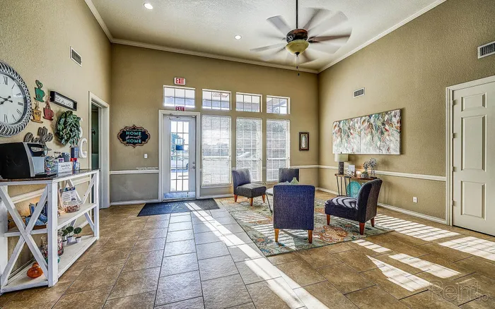 Inviting lobby space with chic seating, natural lighting, and elegant decor, perfect for welcoming guests.