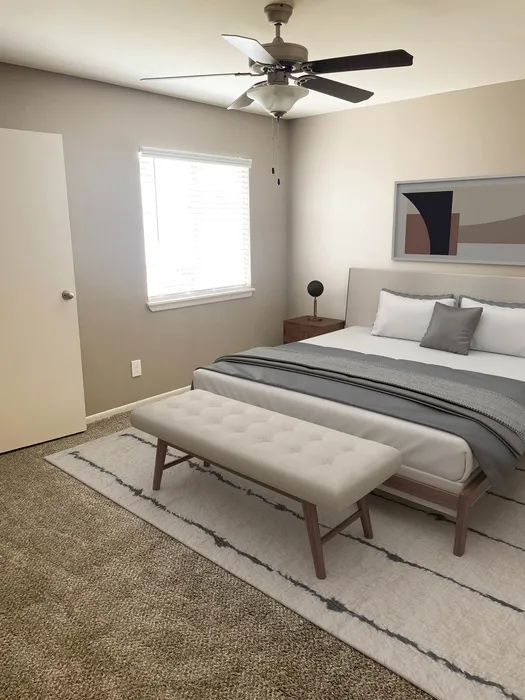 Elegant bedroom featuring a plush carpet, stylish bed with a modern gray and white color scheme, a sleek ceiling fan, and contemporary wall art.