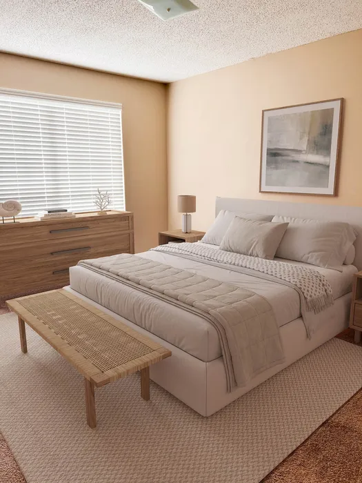 Inviting bedroom with modern decor, featuring a plush bed, warm lighting, and stylish wooden furniture against soothing beige walls.